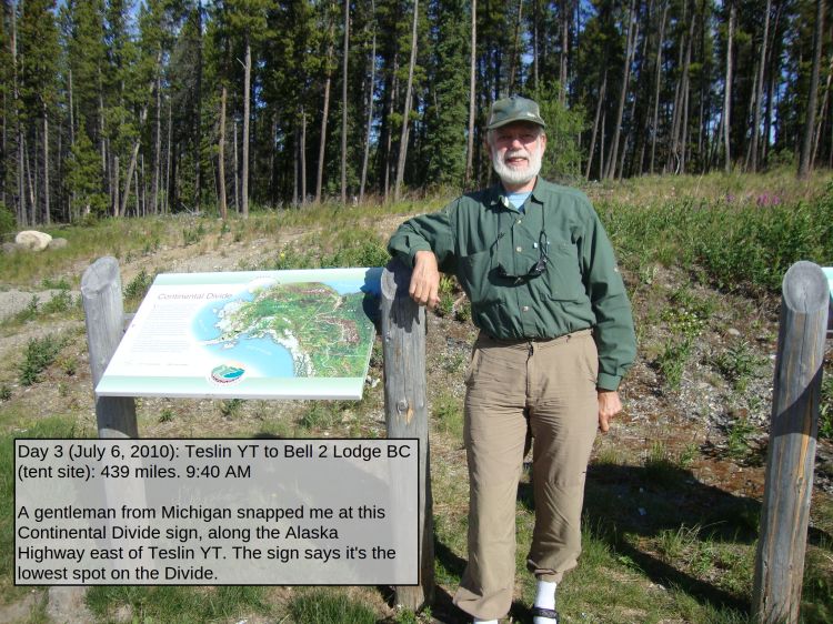 Day 3 (July 6, 2010): Teslin YT to Bell 2 Lodge BC (tent site): 439 miles. 9:40 AM 

A gentleman from Michigan snapped me at this Continental Divide sign, along the Alaska Highway east of Teslin YT. The sign says it's the lowest spot on the Divide. 