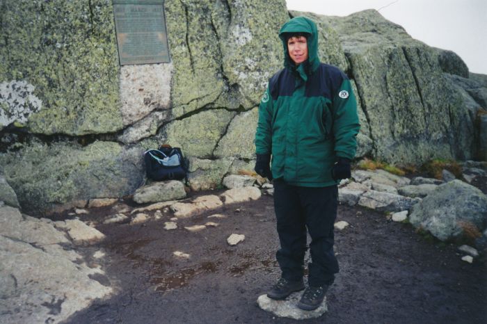 Shaun Robinson, a Nature Conservancy Summit Steward, on Marcy; my daypack is below the plaque. Shaun is friends with the Flow's Judy Rist family.