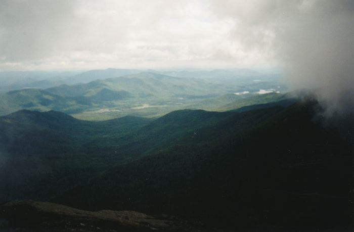 On Schofield Cobble, heading down off Marcy's summit, the mist cleared further. This could be southwest to the Tahawus tailings piles and Lake Henderson.