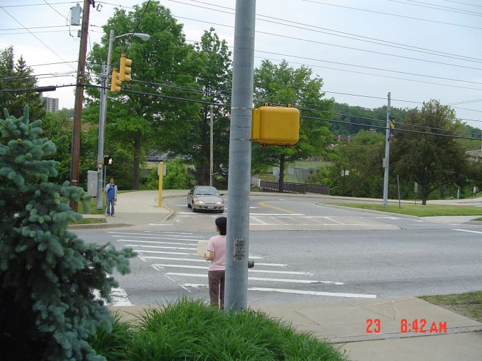 Leaving the busy Towsontown Blvd. as soon as I can, I cut through dorms' and the Enrollment Services building's parking lots to emerge here at a pedestrian crossing of Osler Drive, headed in the driveway to the Student Union parking garage. ET 1:04