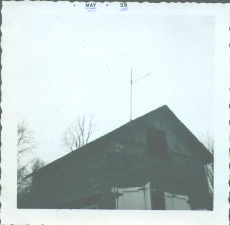 The far end of my General Crystal all-band trap doublet antenna is supported by a pipe that protrudes through a hole in the roof of our little barn, "the Cow Palace." The near end is tied to the house chimney. I believe I bought this antenna at Meadville's Warren Radio shop.