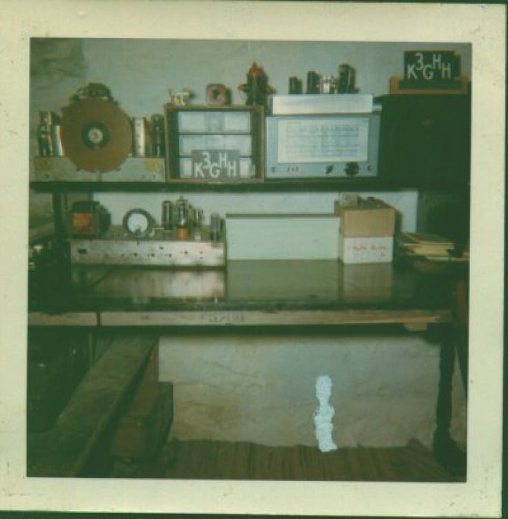 The wall facing the little basement shack's door. I think the bottom left chassis simply has parts sitting on it. The Philco 116-X receiver (from about 1938) is at the upper left, the HRO plug-in coils and S-38D beside it.