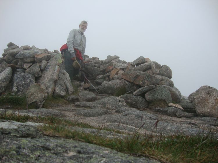 Less than half an hour later, I was at this impressive Devil's Point summit cairn. Although this impressive pinnacle rises directly southwest of the bothy, there was virtually no view in any direction. I enjoyed some trail snack and headed back toward the T, bound for Cairn Toul.
