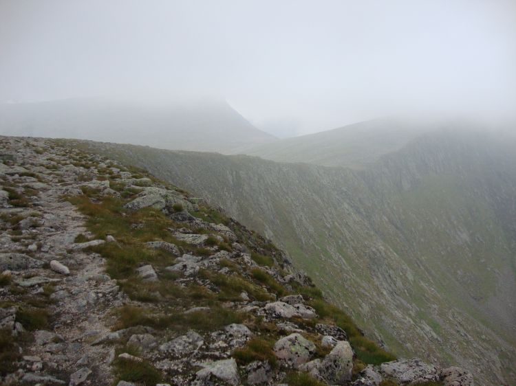 About 12:30  PM, just pulling out of Coire en Saingdear, this is a fairly clear section of trail. It runs disturbingly close to that sharp ridge. I think Cairn Toul, my goal, is in the mist at the right.