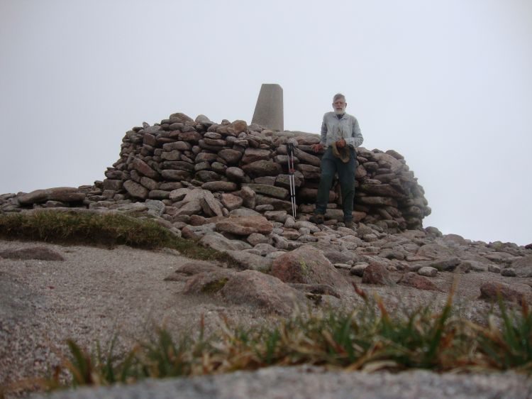 Ben MacDui! Just before 1:00 PM I reached the summit, two hours from Hutchison. The mist and light rain discouraged hanging around. I left at 1:15, but relied on memory and intuition, not on map, compass and GPS, and made a bad mistake...   