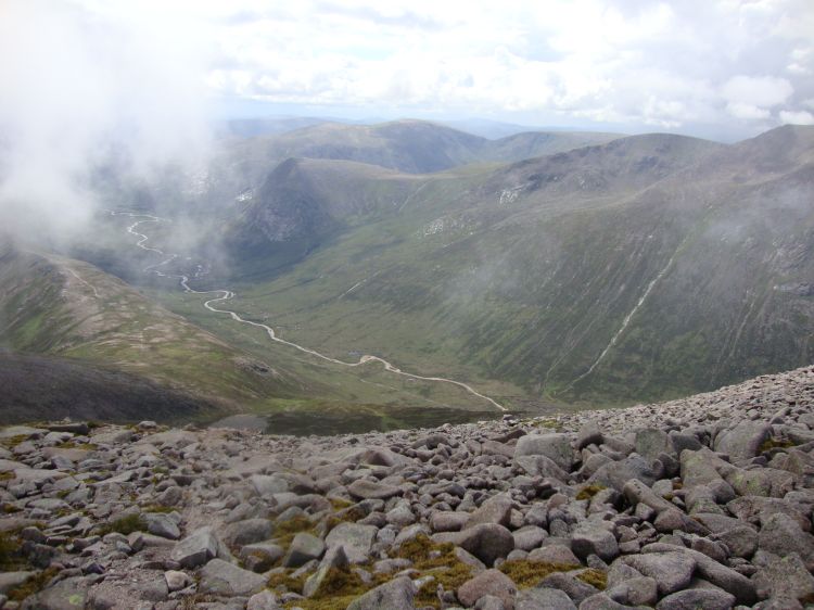 Five minutes down, I snapped this of "Glen Derry"... but it's really Lairig Ghru! I spent an hour wandering around on the southwest face, in confusion and despair, pelted by sleet and rain among boulders much steeper and larger than this, before discovering the Taillear stream at 2:30 PM. Twenty minutes of steep ascent along its bank, and ten minutes across the plateau, brought me back to the main Ben MacDui trail. I was thrilled to see it!