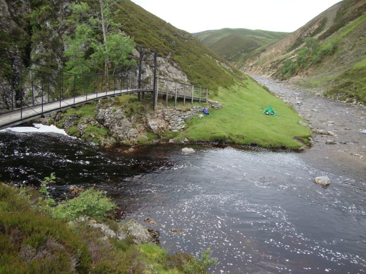 At 3:15 PM I reached the beautiful Falls of Tarf and set up camp. That grass is more level than it looks! My pack, in its blue cover, is near the bridge. For this photo I crossed the bridge and looked back the way I'd come. The River Tilt, along which  I'd walked, is flowing toward us.