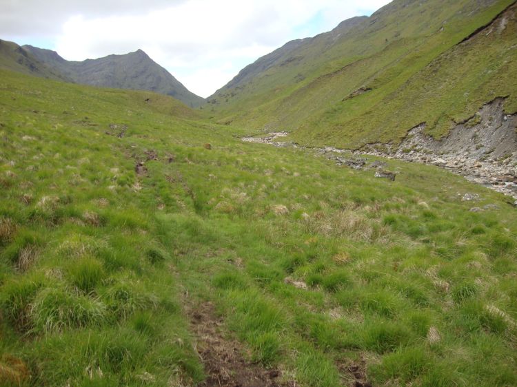 About 11:00 AM, this shows a bit of a path along the right bank of Allt Cairnean and erosion along its left bank. I'm heading for the pass and its gate, in that V between the hills. If the weather had been this nice Wednesday, I might have gone a bit farther on the Cape Wrath Trail.