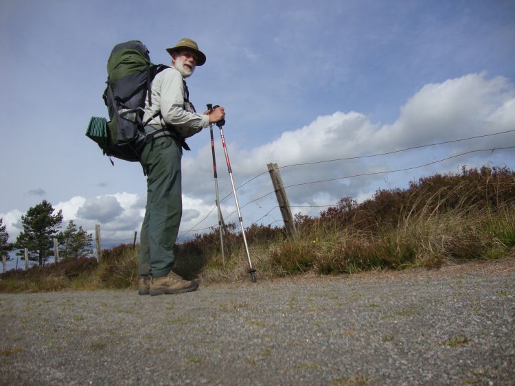Walking north along country roads, high above Loch Ness, an hour and a half out of Abriachan. The Loch is not visible. I was curious what a side shot of my pack looked like. The tripod Davy and I "fixed" worked if one was a little careful.