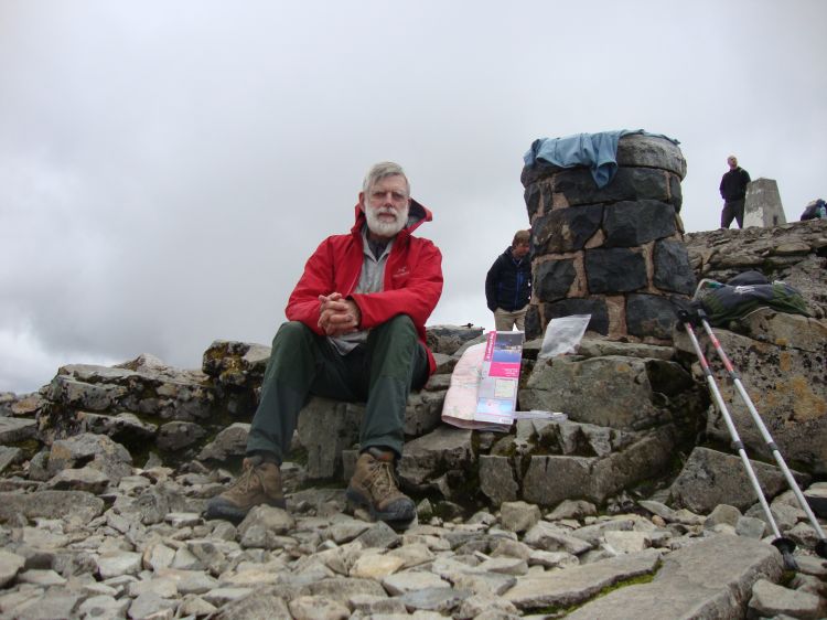 It's about 1:30 and I'm working on my lunch. Immediately on arrival I changed from my damp blue T-shirt into my NorthFace wind shirt. Though generally sunny, it was cool and windy on the Ben Nevis summit. 