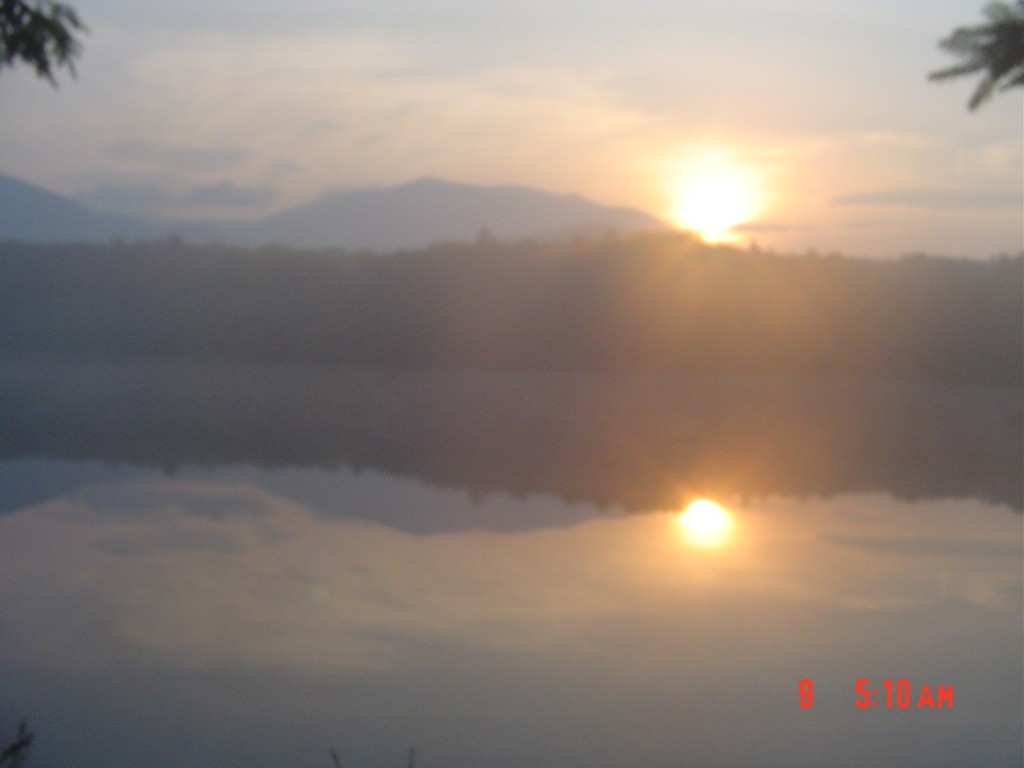 On my first morning out, I arose shortly after 5 AM, photographed this sunrise over Moose Pond at 6:10 AM, and finally pulled out at nearly 8:00. It's July 9, 2008.