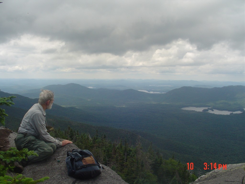 This blustery northwest-facing outcropping just north of the summit offered a view of the Saranac Lakes. The camera's 10-second  timer required a rapid but careful dart back to the edge.