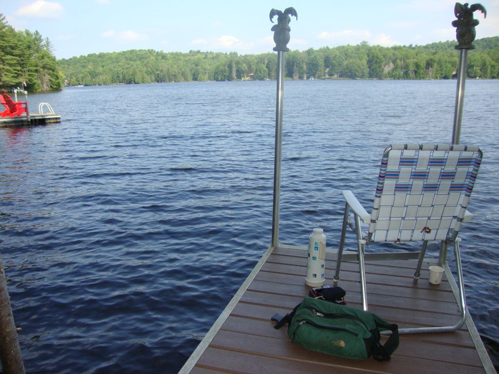 From the dock
Doc on the Dock Doctor dock! Well, not at the moment --- he's taking this photo. I did some reading here but actually prefer the tent site. (Purchasing this to replace our old pallets on rocks was one of my better ideas!)