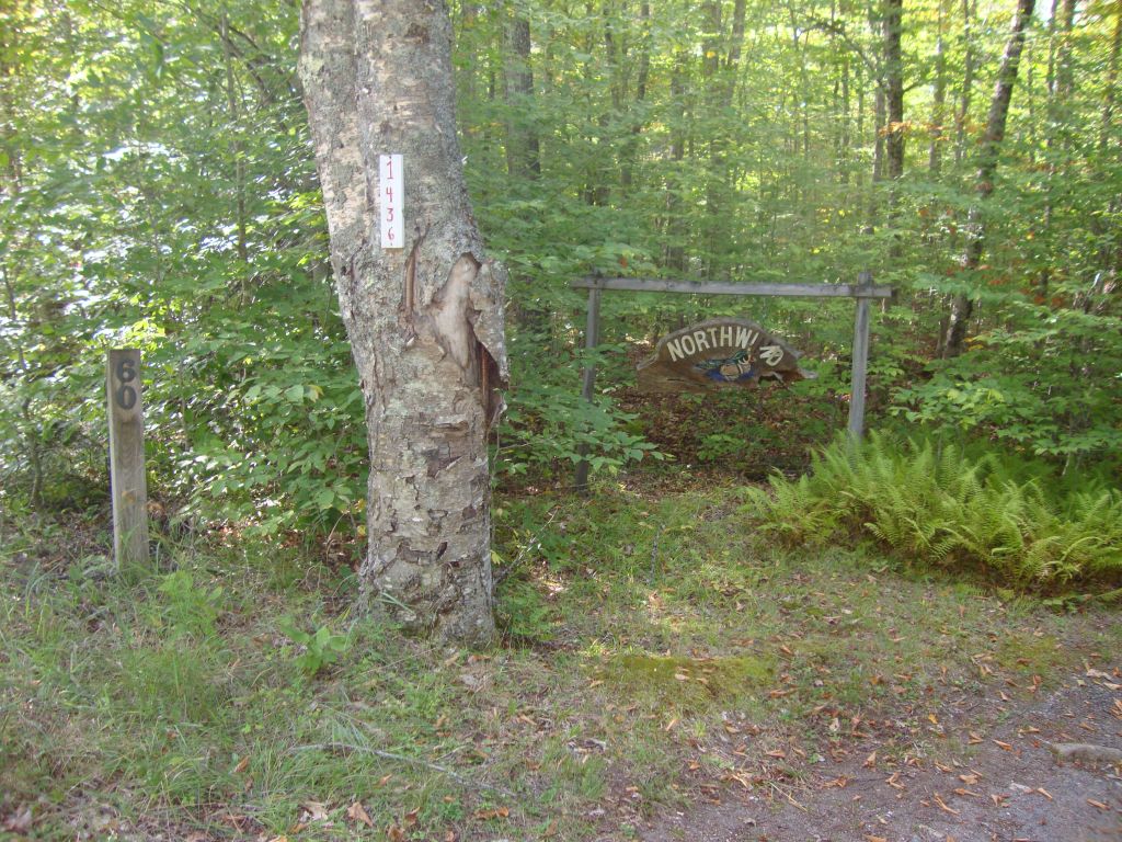 A beautiful, now sad, camp sign at The Flow
My friend Betty Greene, a charming and delightful lady a bit older than me, a 46'er whose daughter and grandson are also 46'ers, died since I last saw her in 2018. She would have taken care of her sign immediately. I do not know if she died in the winter of '18-'19 or of '19-'20. I was at the Flow for only a few days in the Fall of 2019. 