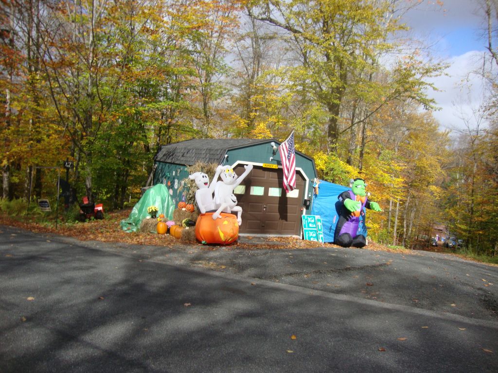 Dave Dorey's Camp 47
I OK'd a zoning variance for this garage (close to the road) but expected something like just the green/brown structure. Dave always manages to make his driveway look like a carnival.