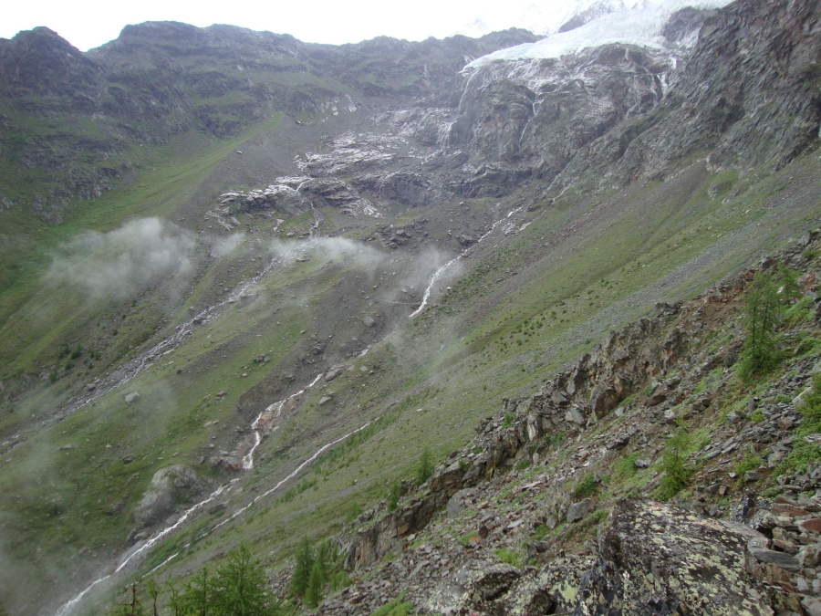 This is the Europaweg, half an hour after I left the Europahutte in rain gear on Monday, July 2! A faint horizontal line can be seen at the photo's center, where the path crosses the stream, and extended to the right. Exhilarating... and scary!