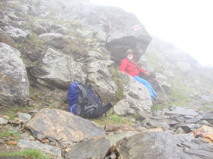 At 12:15, this was the best shelter I could find for a lunch stop. Mist is rolling up from the valley. The morning had featured lightning, thunder, sleet... and an ominous rumbling I think was a rock slide.
