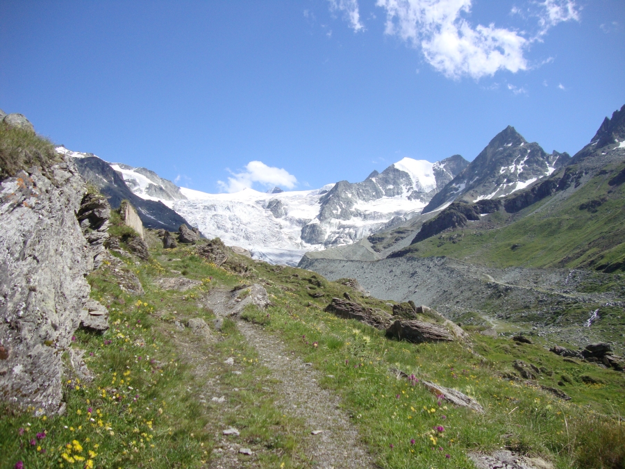 At 4:00 PM, after a little over 8 hours of walking today, this is the trail ahead. Cabane de Moiry may be visible, a little bump on the gray rock.