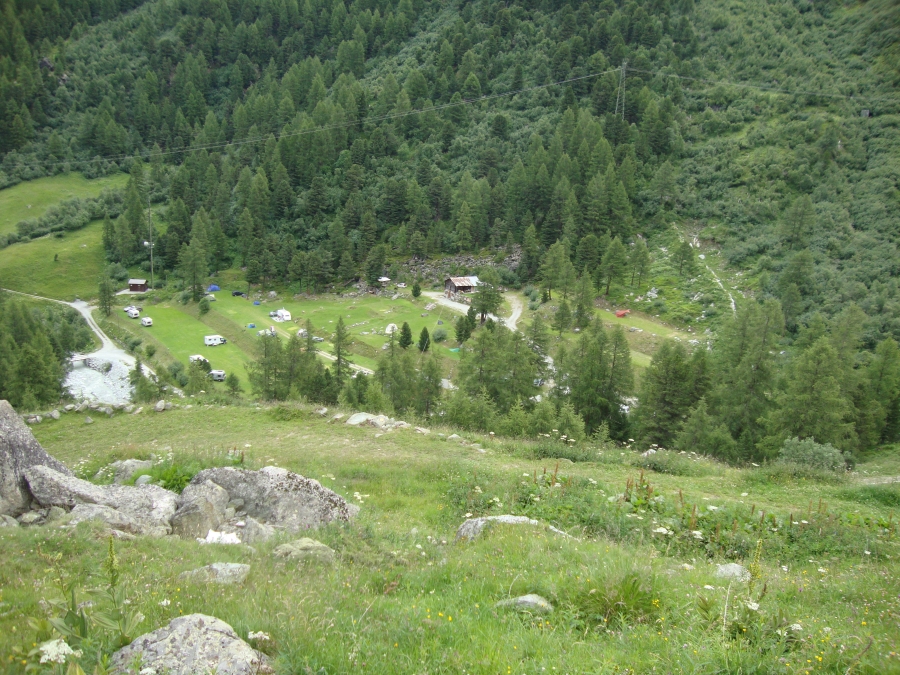 I saw the campground about 4:00 PM, reached Arolla at 4:20, and was setting up my tarp here at 5:00 PM. This Friday (July 13) morning shot is on a walk up to the town center; the green tarp is in the center, to the right of a pair of fir trees.   