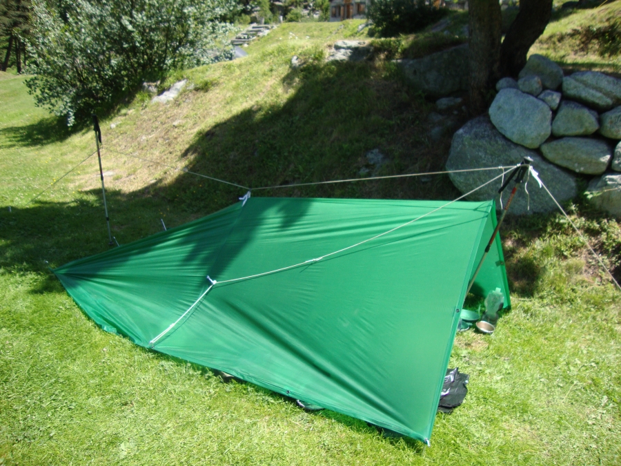 Monday, July 16, I tried another configuration. That second pole, with the center tape, raises the tarp so well that the foot of my sleeping bag no longer made contact with it. This is better than the open method I tried earlier!  